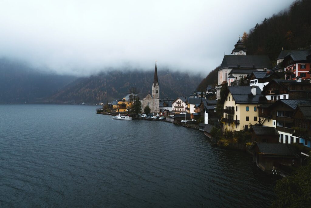 hallstatt village austria reflected in lake alpine mountains